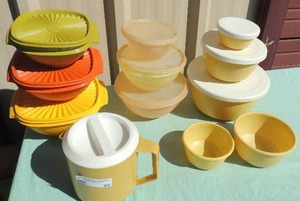 lot 90 image: Rubbermaid 1.5qt. Pitcher, Bliss craft nesting bowls 3 with lid 2 without Tupperware 3 nesting bowls with lids, Tupperware 3 nesting bowls with lids green, yellow and orange