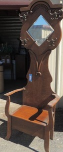 lot 5 image: Late Victorian Hall Tree with cast iron hooks, lift top bench. Beveled mirror and denton molding accents