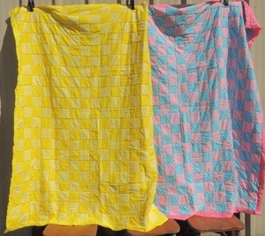 lot 115 image: 2 handmade quilts pink & blue and yellow & white