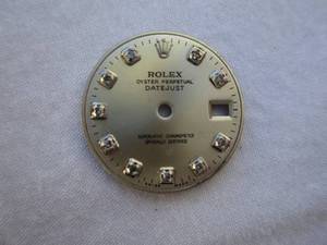 lot 8 image: ROLEX Silver Datejust Dial With Genuine Diamond Hour Markers, 7898 On Back, About-20mm Rd.  With Face Retainer Ring