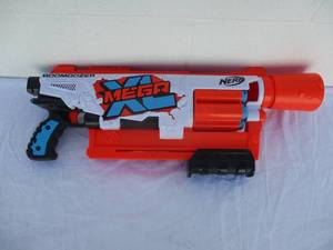 lot 38 image: NERF (Display Model) Mega XL -Boom Dozer Blasters, Largest Mega Darts Ever, XL 6-Dart Rotating Drum, With Mega XL Whistler Darts, Pump Action-Works