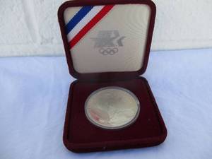 lot 25 image: 1984-XXIII Los Angeles Olympiad One Silver Dollar Coin in Collectors Case