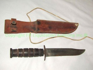 lot 138 image: Genuine Kabar USMC combat knife in leather sheath, Marked USMC and KABAR