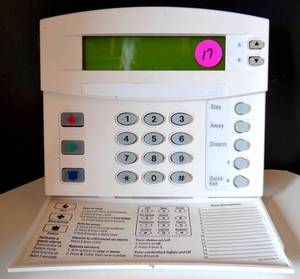 lot 17 image: Interlogix 60-983 ATP-1000 Alphanumeric Touchpad Thermostat