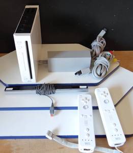 lot 51 image: Wii GAMING SYSTEM AS SHOWN WITH 2 CONTROLLERS CHARGERSENSOR BAR - MODEL RVL-001