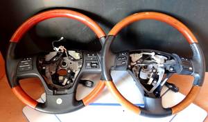 lot 105 image: LEXUS RX350 WOOD GRAIN AND LEATHER OEM STEERING WHEELS WITH CONTROLS (1 FITS 2007-2009. THE OTHER 2010-2012) $$$