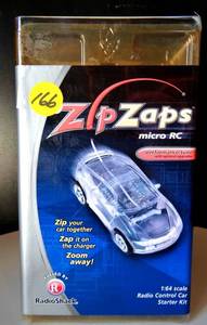 lot 166 image: VINTAGE RADIO SHACK ZIPZAPS MICRO RC STARTER PACK