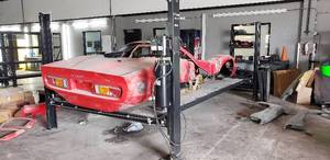 lot 52 image: Mossberg 8,000 Lb Capacity Car Lift