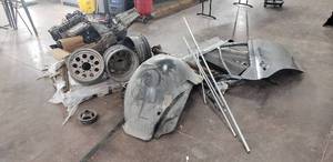 lot 87 image: Lot of Miscellaneous Parts - Wheels, Transmission, Drive Shaft, Doors, Fenders, Hood, Jeep Liberty Engine, and More