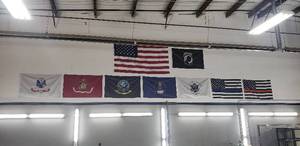 lot 101 image: Lot of 9 Flags - Buyer is Responsible for Removal