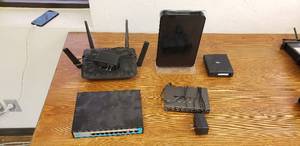 lot 219 image: Lot of Routers, Network Switches, and Sling Box
