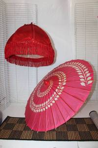 lot 31 image: Large Paper Umbrella or Parasol, Red Fringe Lamp Shade, and 8.5 Ft. Roll-Up Bamboo Floor Mat
