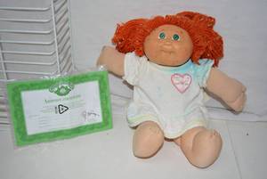 lot 118 image: Cabbage Patch Doll with Adoption Certificate unmarked