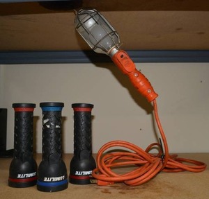 lot 377 image: Orange Hanging Work Light and 3 Lumilite Flashlights (Need Batteries)
