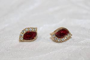 lot 425 image: Swarovski Crystal poststud earrings. Marked with Swarovski swan logo on both.