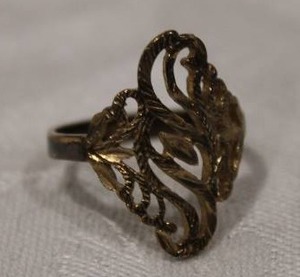 lot 429 image: Continental Sterling Silver laser cut filigree ring. Marked Silver. Size 9