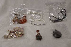 lot 446 image: Natural jewelry selection. Includes an Amethyst 1.5L crystal pendant on cord, Moss agate pendant, ceramic faux turquoise and copper pendant and a faux Amber pendant necklace. Also includes (2) shell necklaces