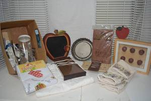 lot 41 image: Kitchen Lot Tablecloths, Hot Plate, Roasting Rack for microwave, Apple Decorations and More