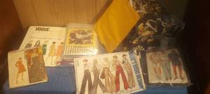 lot 60 image: Assortment of sewing patterns and a little fabric
