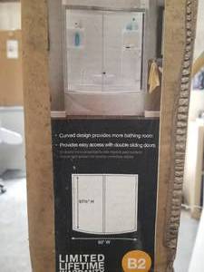 lot 16 image: American Standard - Ovation - curved sliding bath door - 57.5 by 60
