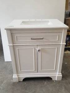 lot 17 image: White bath vanity with vanity top - has crack