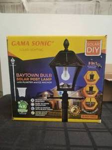 lot 59 image: Baytown bulb solar post lamp with planter