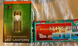 lot 35 image: Slingshot and solar rechargeable solar LED lantern