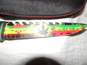 lot 47 image: Hunting knife  Skulls with JAMACAIN  flair  7 blade nylon sheath