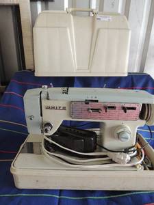 lot 215 image: White sewing machine in case with needles