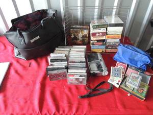 lot 225 image: Cassettes, battery powered radio, VHS, assorted decks of cards and puzzle in Mary Kay bag