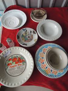 lot 228 image: Dish set- Apple pie pie plate, 2 Correlle dinner plates and 4 small ones, 3 Oneida bowls,  4 butterfly plates, S&P shakers and assorted bowls