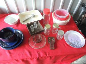 lot 232 image: Blue ceramic dishes 4 plates 3 bowls, 1 sm platee  Jars, bowls metal casserole dish small glass bottles and more