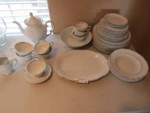 lot 84 image: Poland Royal Kent white gold rimmed china - Teapot, 8  teacups, 5 saucers, 1 large bowl, creamer, 8 soup bowls, 12 platter, 8 dinner plates  33 pcs