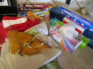 lot 114 image: Opened foil, wax paper plastic wrap and storage bags. Placemats and hand towel too.