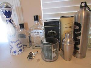 lot 125 image: Assorted empty liquor bottles like Azure and other designers