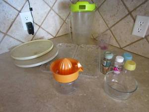 lot 140 image: Misc. kitchen lot- toothpic holder, juicer, lazy Susan 2 plastic platters