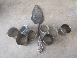 lot 142 image: Silver Merry christmas cake knife and napkin rings