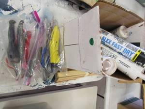 lot 42 image: Misc. lot- plyers, wire cutters, exacto knives, bag of caulk and more
