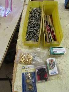 lot 192 image: Dremel tools and accessories, 2 yellow tubs of nails, box of staples