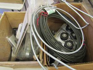 lot 203 image: Box of household light switches plus tubing and tub benders