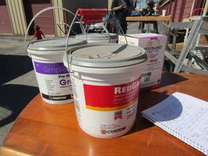 lot 229 image: 2 NEW 1 gallon containers of simple grout, 1 box sanded grout, and 1 NEW Red guard water proofing membrane