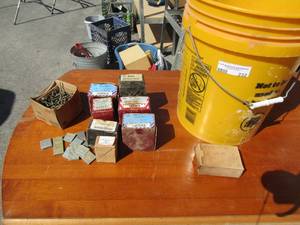 lot 232 image: Large staples, tapping screws 1.25, tapping screws .25, hex nuts .15, other assorted long screws