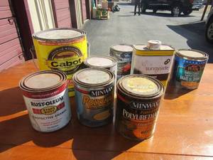 lot 234 image: Large gray tote full of used trim paint, spray paint, enamel, stain, and black paint (all opened)