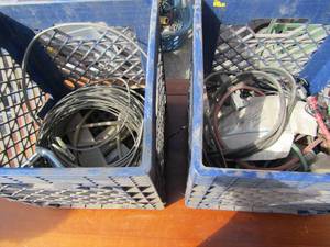 lot 235 image: 2 blue tubs of wire plug strips, bungees cords and harness brackets