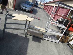 lot 238 image: 8 foot plastic shelving 5 tier,   2 tier metal shelving has wood slats and one that just has frame both need talc