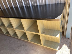 lot 403 image: COMMERCIAL GRADE DISPLAY SHELFTABLE WITH CUBBIES - FOR SHIRTS, PANTS, GAMES HAS 12 CUBBIES PER SIDE  36 H X 36D X 96 L GFEEN & BLACK  - HEAVY