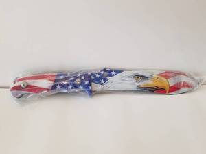 lot 31 image: American flageagle knife - blade is 7 34 and overall length is 13 - new