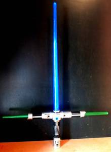 lot 39 image: STAR WARS STYLE 3 WAY LIGHT SABER - POWERS ON (MISSING HANDLE)