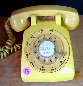 lot 83 image: VINTAGE ITT ROTARY TELEPHONE (SUN YELLOW) - WORKS