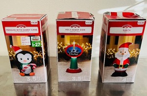 lot 57 image: Christmas Front Yard Inflatables 3.5-4.0 Ft Tall - Penguin with Candy CaneHoly Night SignSanta